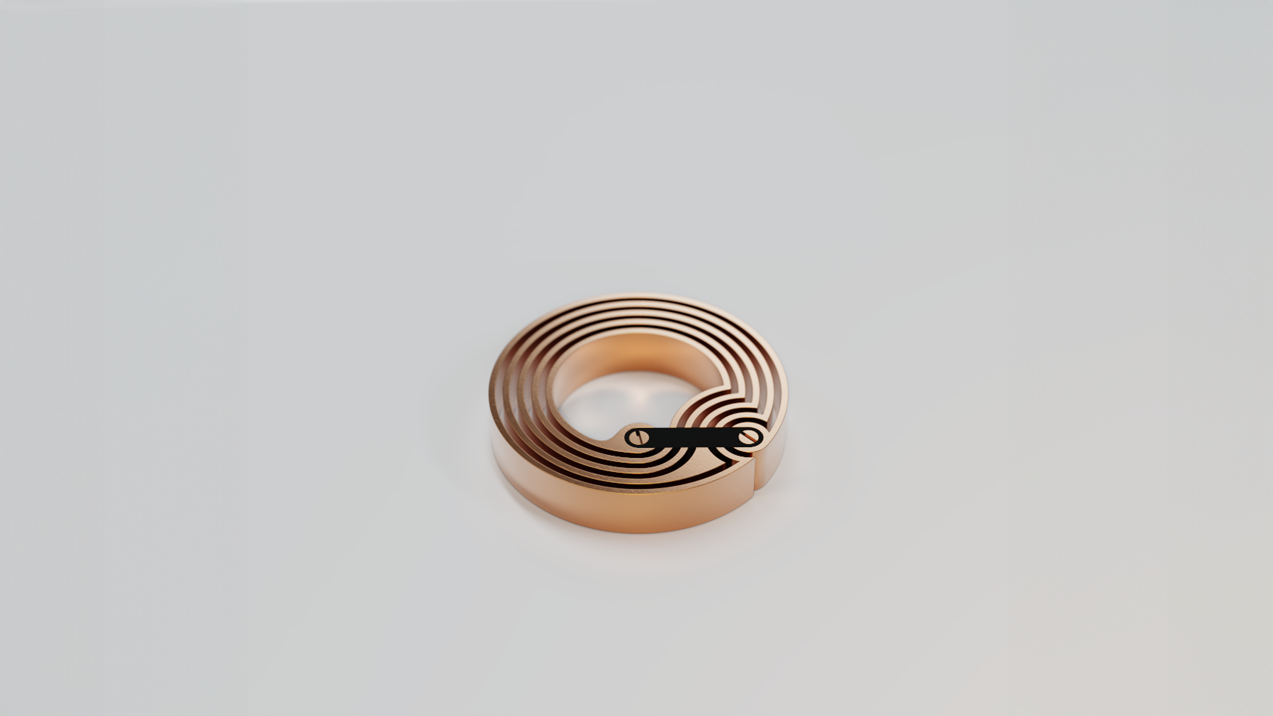 Near Field Circuit - A copper-plated brass circular object with concentric rings and an embedded NFC chip